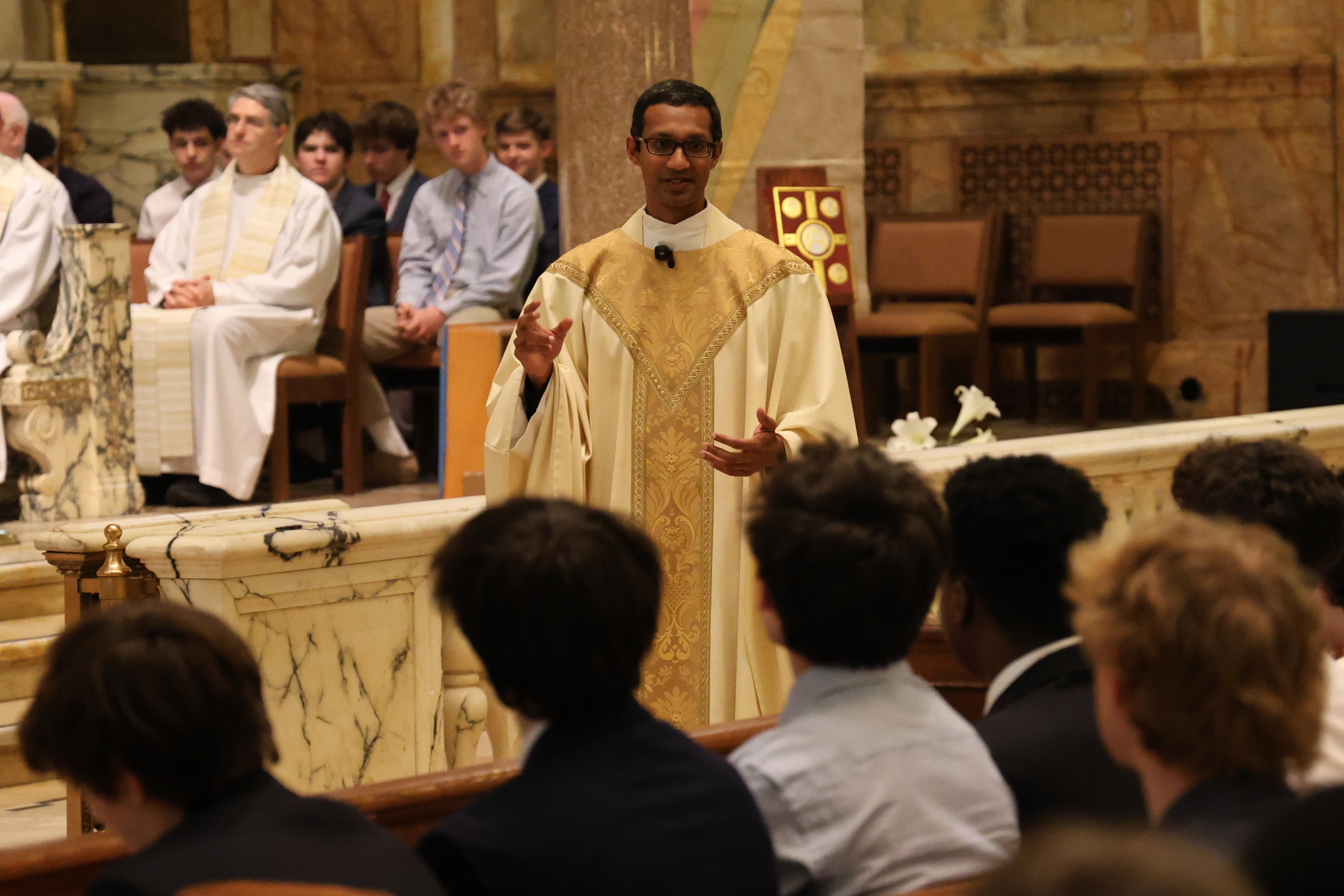 Rev. Melvin Rayappa, SJ, ’08 Celebrates Easter Liturgy for Regis Community